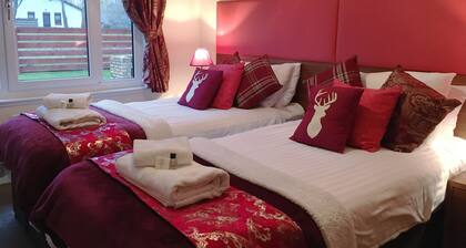 The Eagle sleeps 8-10 with log burning stove, sauna, BBQ and enclosed garden.