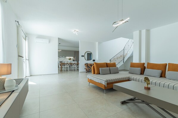 Villa, Pool View | Living area | 35-inch TV with digital channels