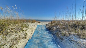 A beach path leading to the sea, surrounded by sand and sparse vegetation. - 4205 Island Club - Folly Field - 2 Bed 2 Bath Sleeps 5 - Hilton Head Rentals (Hilton Head Island)