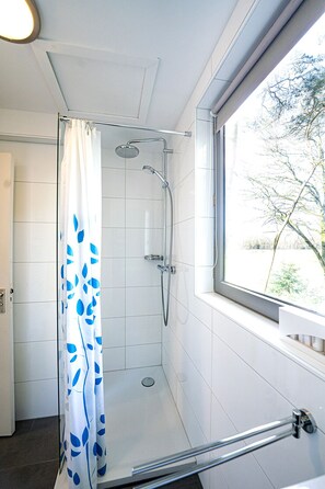 Shower, hair dryer, towels, soap