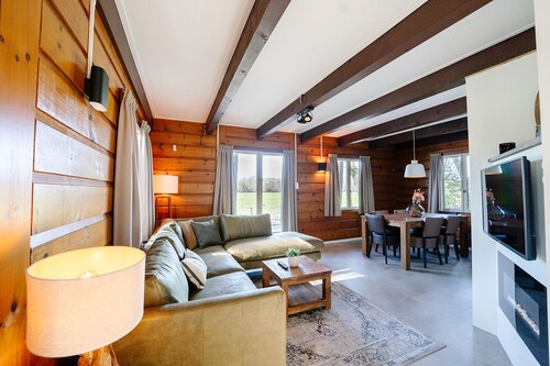 Atmospheric Canadian Lodge located by meadow