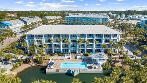 A large hotel with multiple floors, a central courtyard, and a pool area. - ☀️Beach Access-3 Pools-Gulf View-Gulf Place Cabanas 210 (Santa Rosa Beach)