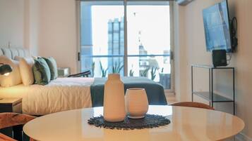 Superior Studio, Balcony, City View | Living room | Smart TV