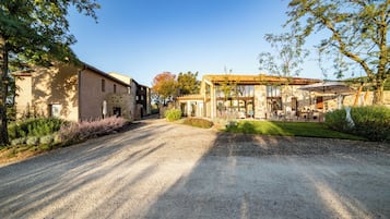 Experience the tranquil atmosphere of this traditional property, featuring a patio area with outdoor seating and a rustic charm.