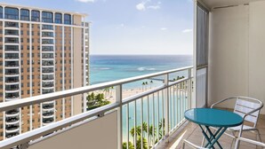 A balcony with a view of the ocean and a beach, overlooking a high-rise building. - Ocean View Waikiki Retreat at the Iconic Ilikai Hotel Near Beach and Ala Moana (Honolulu)