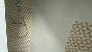 Shower, hair dryer, towels, toilet paper