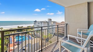 A balcony with a view of the ocean and a pool area. - Ocean Forest Plaza 606 -1BR/1BA- Pool (Myrtle Beach)