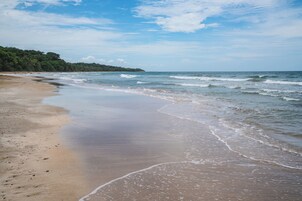 On the beach, sun loungers, beach towels