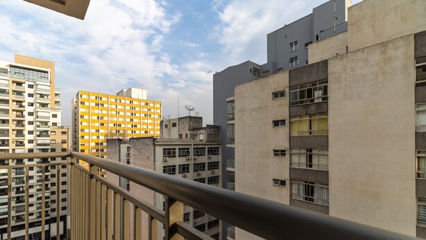 A high-rise building with multiple balconies and a yellow facade. - Miq277-1107 in S o Paulo (São Paulo)