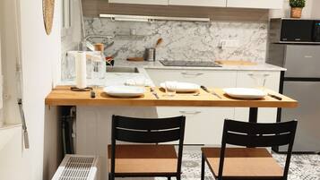 Fridge, microwave, stovetop, coffee/tea maker