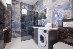 Shower, hair dryer, towels, soap