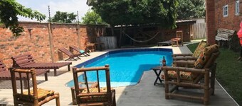 Seaside Serenity Suites – 9 Luxury Bedrooms ,Calm Living with Pool, WiFi