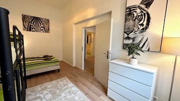 1 bedroom, desk, iron/ironing board, travel crib