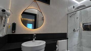 Deluxe Apartment, Balcony, Mountain View | Bathroom | Shower, hair dryer, towels, soap