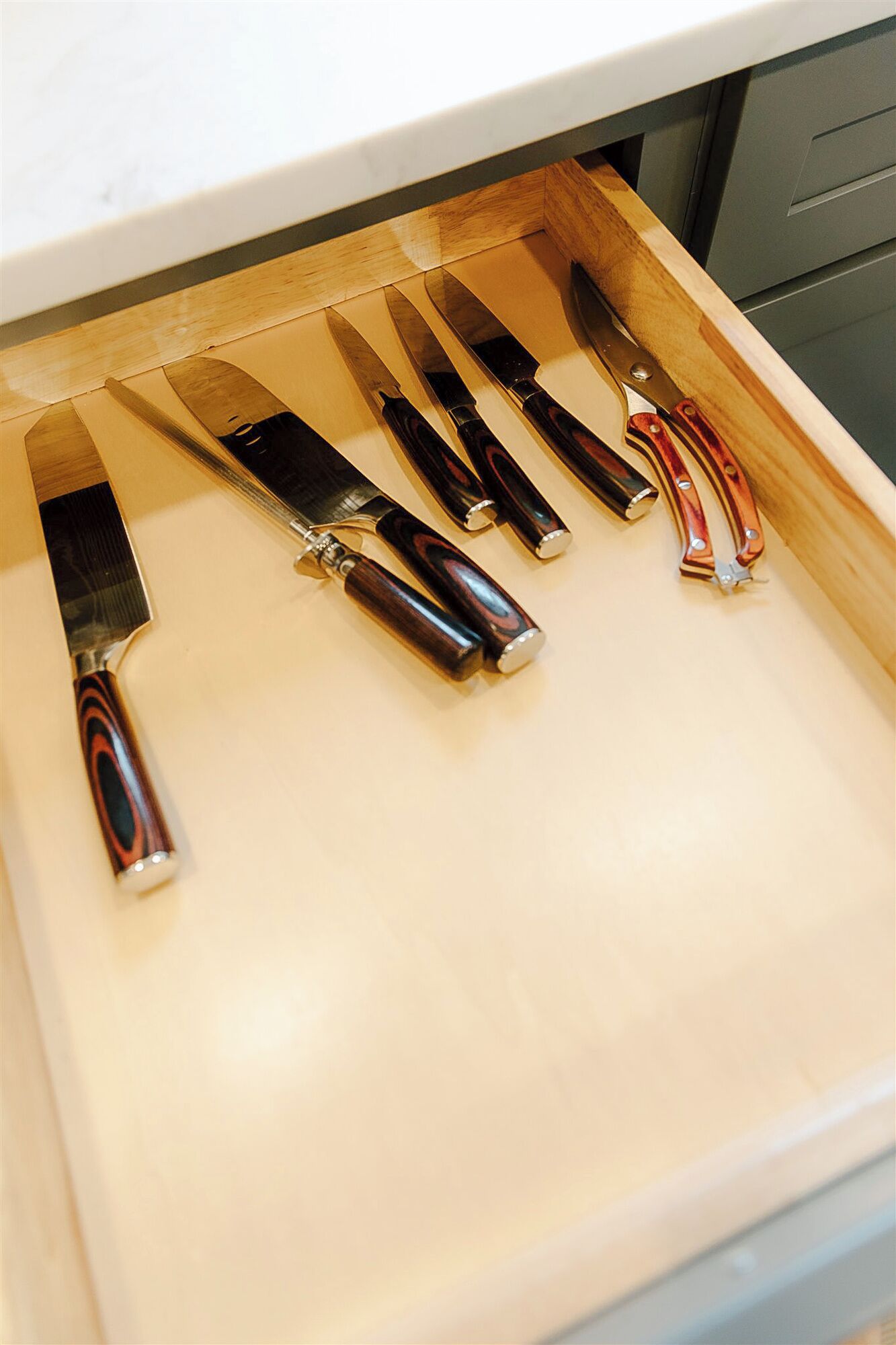 A drawer with knives.