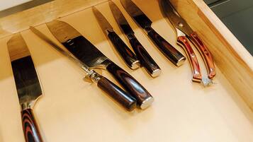 A drawer with knives.