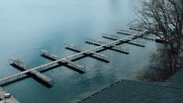 A dock extending into calm water with a wooden pier structure.