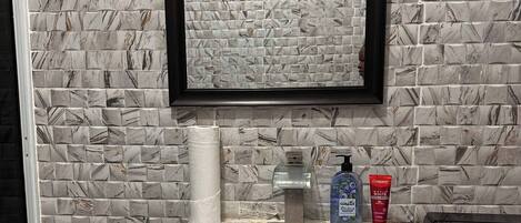 Hair dryer, towels, soap, toilet paper