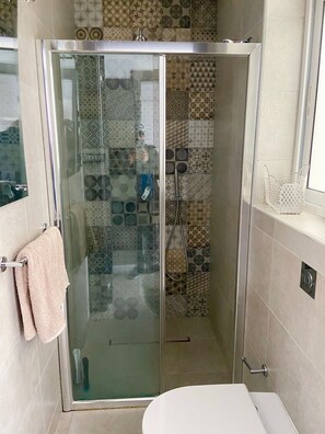 Shower, hair dryer, towels, soap