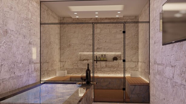 A modern bathroom with a glass-enclosed shower, a marble sink, and a wooden bench.