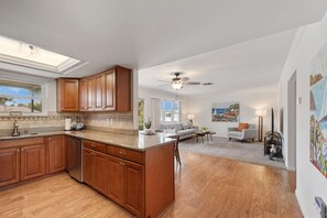 Enjoy a homey kitchen with a dishwasher, dining area, and comfortable seating.