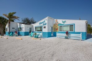A building with the name 'Mermaid Tales' and a mural of a mermaid. - Mermaid Tales 3BR #1, #5, and #6 (Fort Myers Beach)