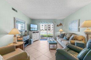 Condo, 1 King Bed (Sea Coast Gardens III 108) | Living area | TV - Sea Coast Gardens III 108 (New Smyrna Beach)