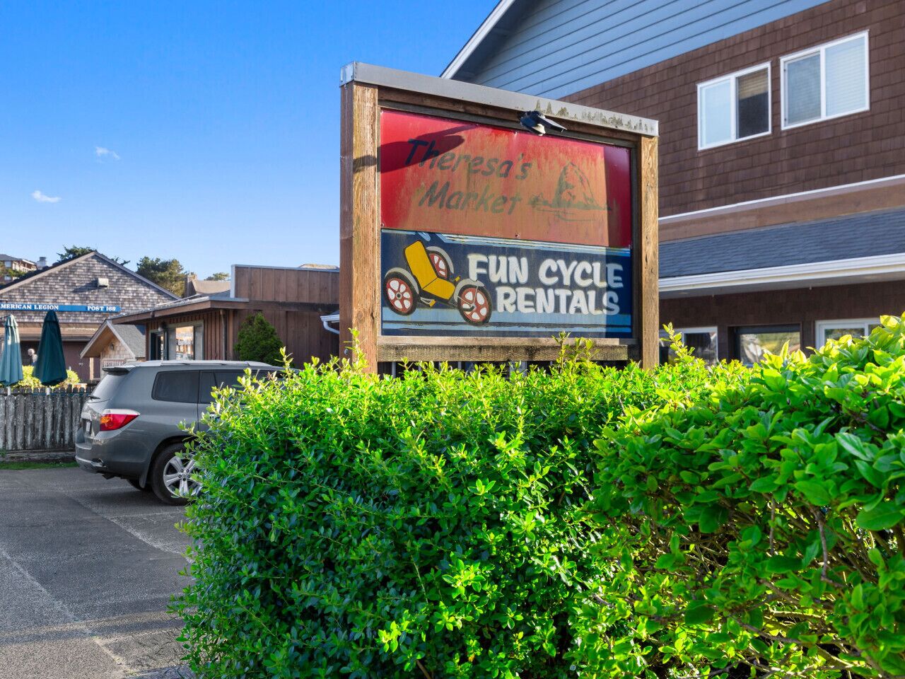 A sign for Theresa's Market advertising fun cycle rentals.