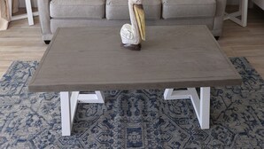 A living room with a sofa, two side tables with lamps, a coffee table, and a patterned rug. - Casa Playa #502 Beach Front - Gulf Front Getaway (Fort Myers Beach)