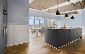 Fridge, stovetop, dishwasher, coffee/tea maker