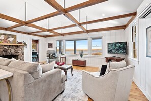 TV, books - Nauset Harbor Cottage: 112-O  Charming Coastal Retreat with Breathtaking Views – East Orleans (Orleans)