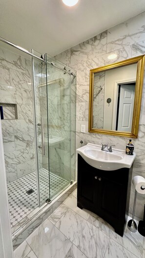 Shower, hair dryer, towels, soap