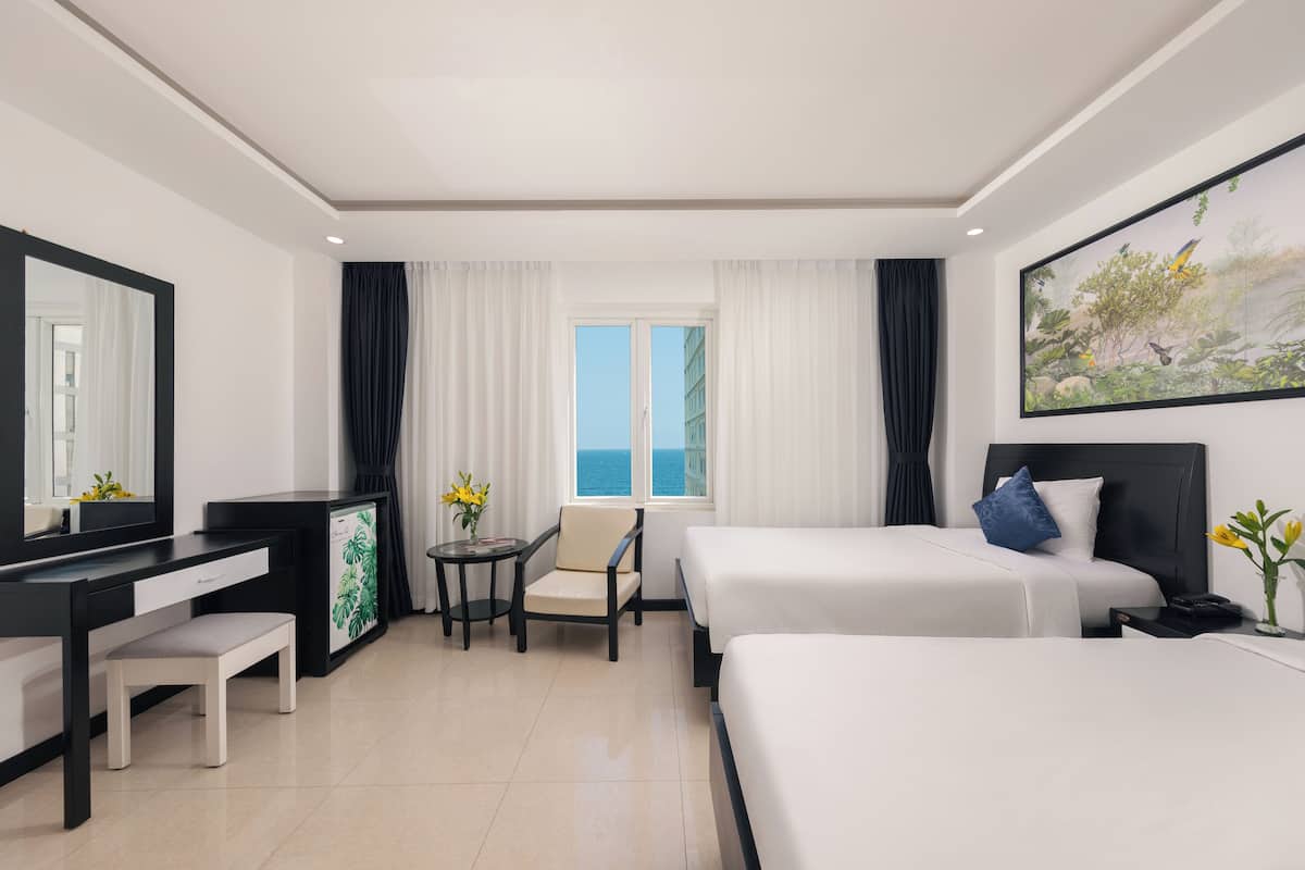 Deluxe Triple Room, Sea View | 1 bedroom, premium bedding, minibar, in-room safe