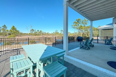 Experience luxury at 'Washed By The Water', a spacious 4-bedroom private home in Orange Beach, AL