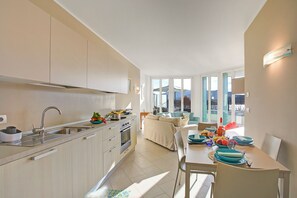 Enjoy meals in the kitchen with ample counter space and a stainless steel sink, and dine at the table set for four.