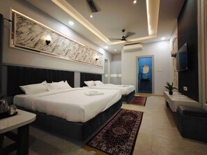 Deluxe Quadruple Room, City View | Desk, laptop workspace, free WiFi, bed sheets - Hotel Nainas Palace (Ujjain)