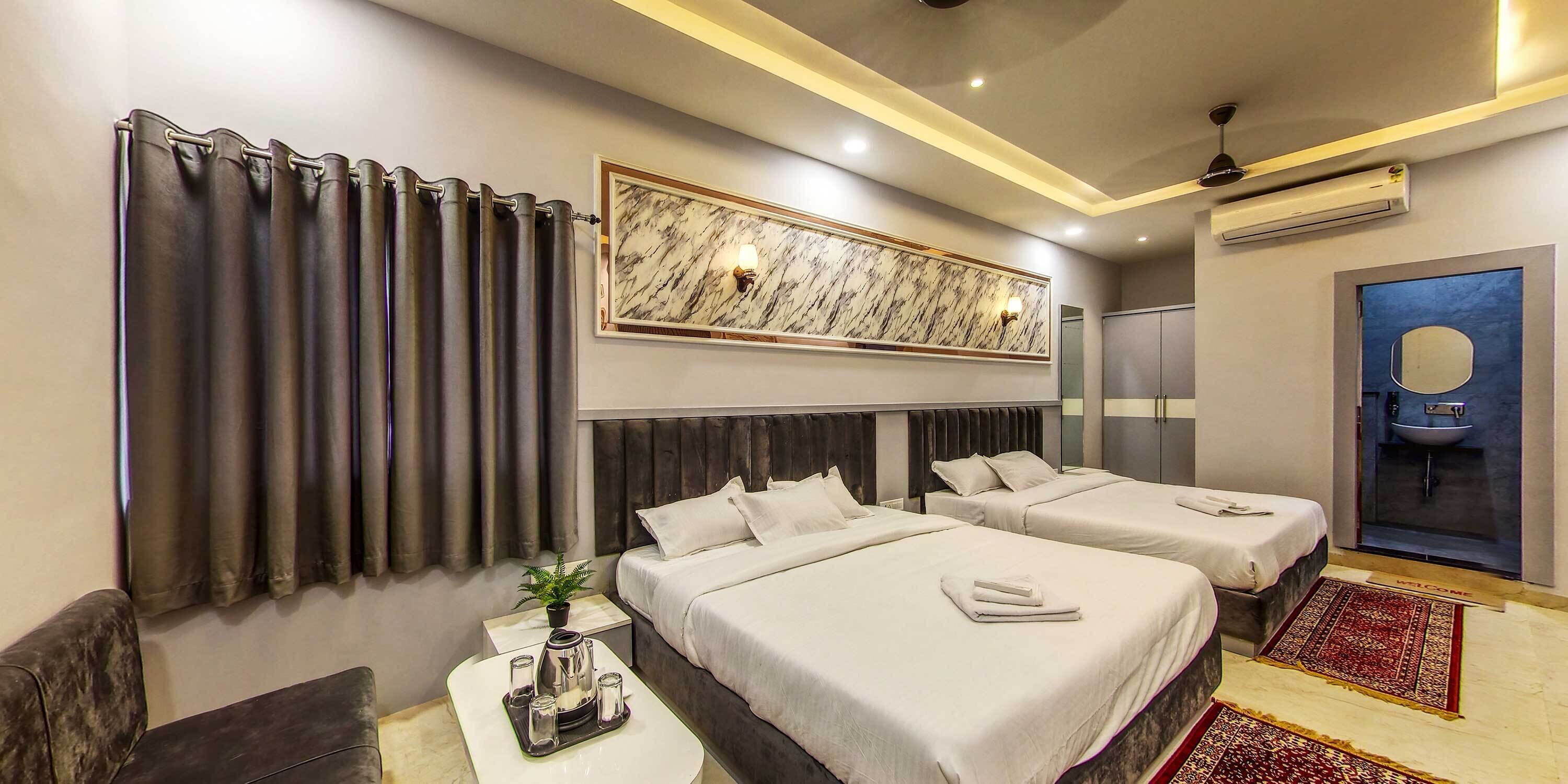 Deluxe Quadruple Room, City View | Desk, laptop workspace, free WiFi, bed sheets