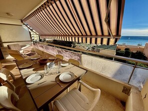 Enjoy a meal on the balcony with a view of the sea.
