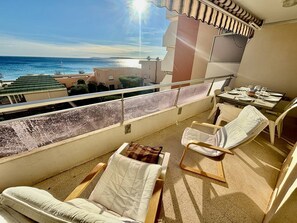 Enjoy a meal or relax on the balcony with a clear view of the sea.