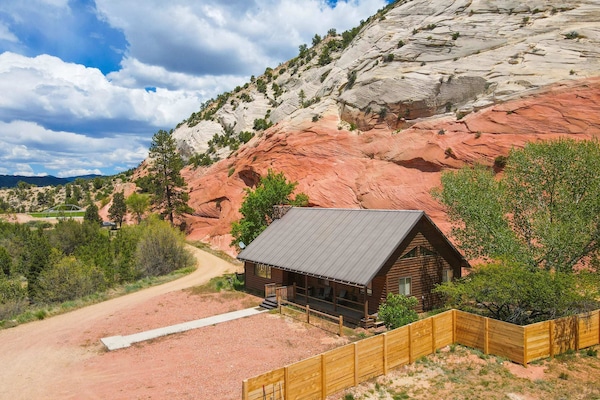 Nestled in the pituresque red rock of Southern Utah! This Cabin has the majestic cliffs right in the back yard! One of the most unique stays near Zion National Park.