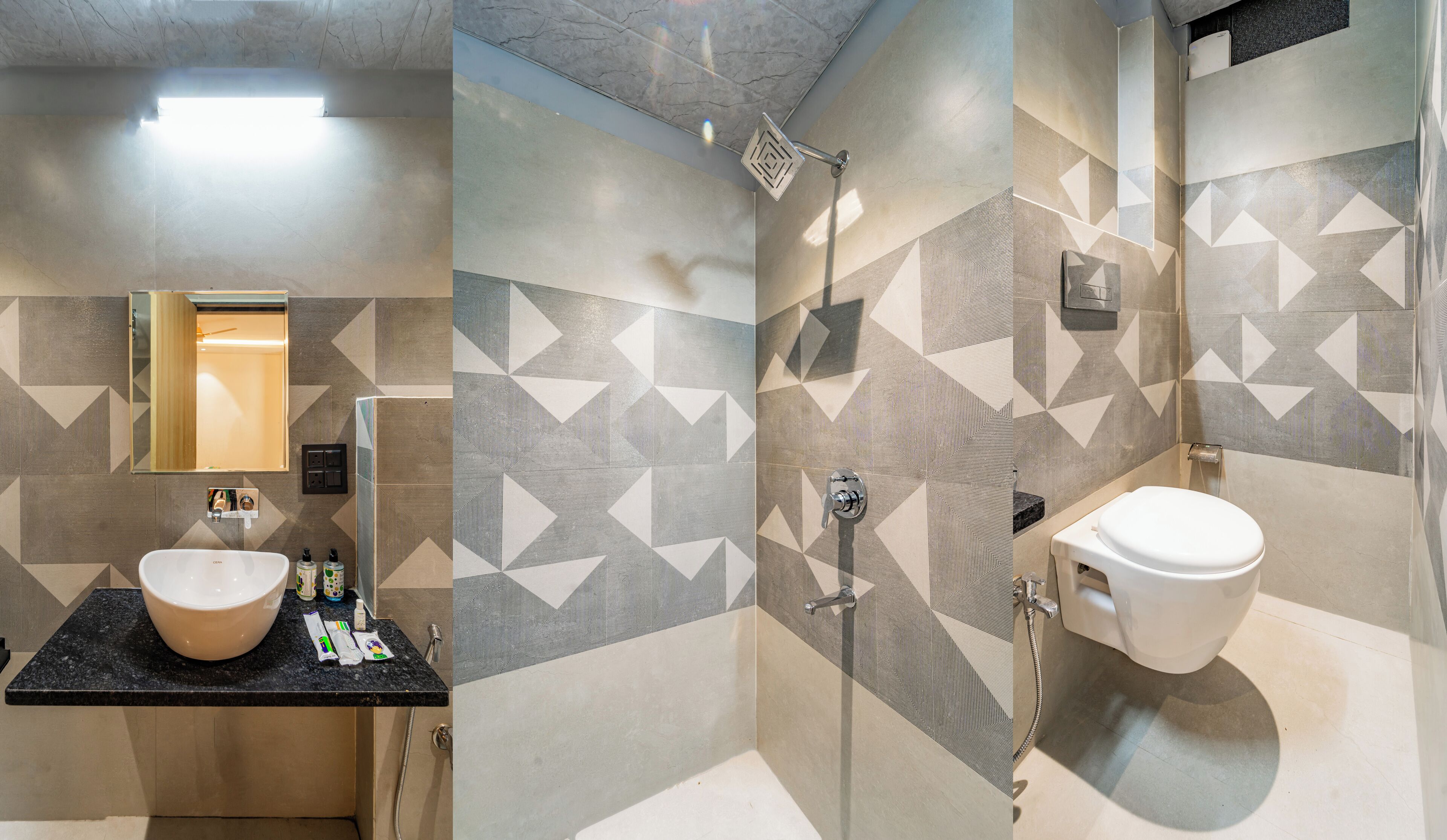 A bathroom with a sink, mirror, and shower.