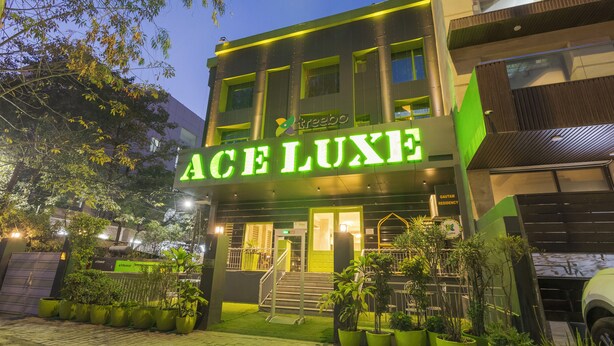A modern building with a sign reading "ACE LUXE" and a gated entrance. - Treebo Ace Luxe (New Delhi)