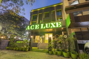 A modern building with a sign reading "ACE LUXE" and a gated entrance. - Treebo Ace Luxe (New Delhi)