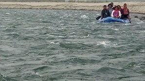 A group of people in a blue raft on a river. - N Palky Camp By GRB (Chariduar Circle)