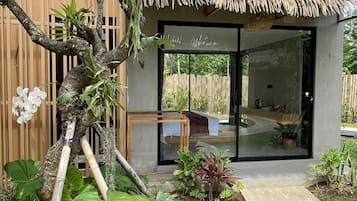 Deluxe Room, Garden View | Terrace/patio