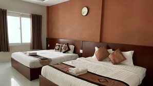 A modern hotel room with two beds, a large window, and a clock on the wall. - Volga Hotel Mui Ne (Mui Ne)