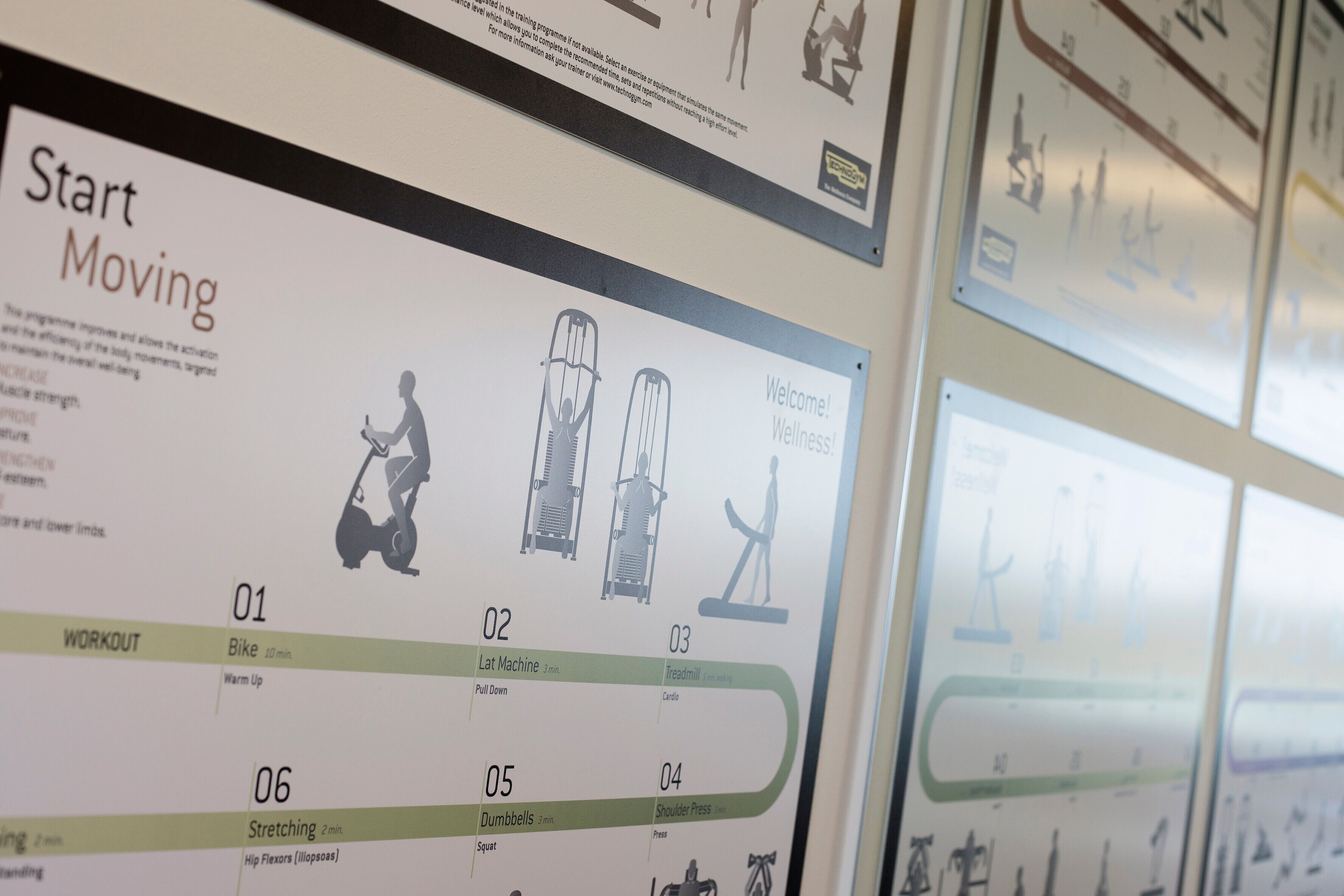 A fitness program poster with exercises like bike, lat machine, treadmill, dumbbells, and stretching.