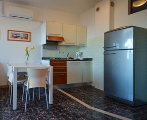 Fridge, microwave, stovetop, cookware/dishes/utensils