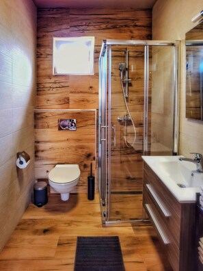 Shower, hair dryer, towels, toilet paper