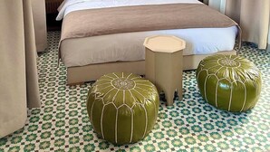 A hotel room with a large bed, two bedside lamps, a hanging lamp, and a patterned floor. - Magnificent Riad Kechmya 5 suites bassin Rooftop Proche Jemaa El Fna Majorelle  (Marrakesh)